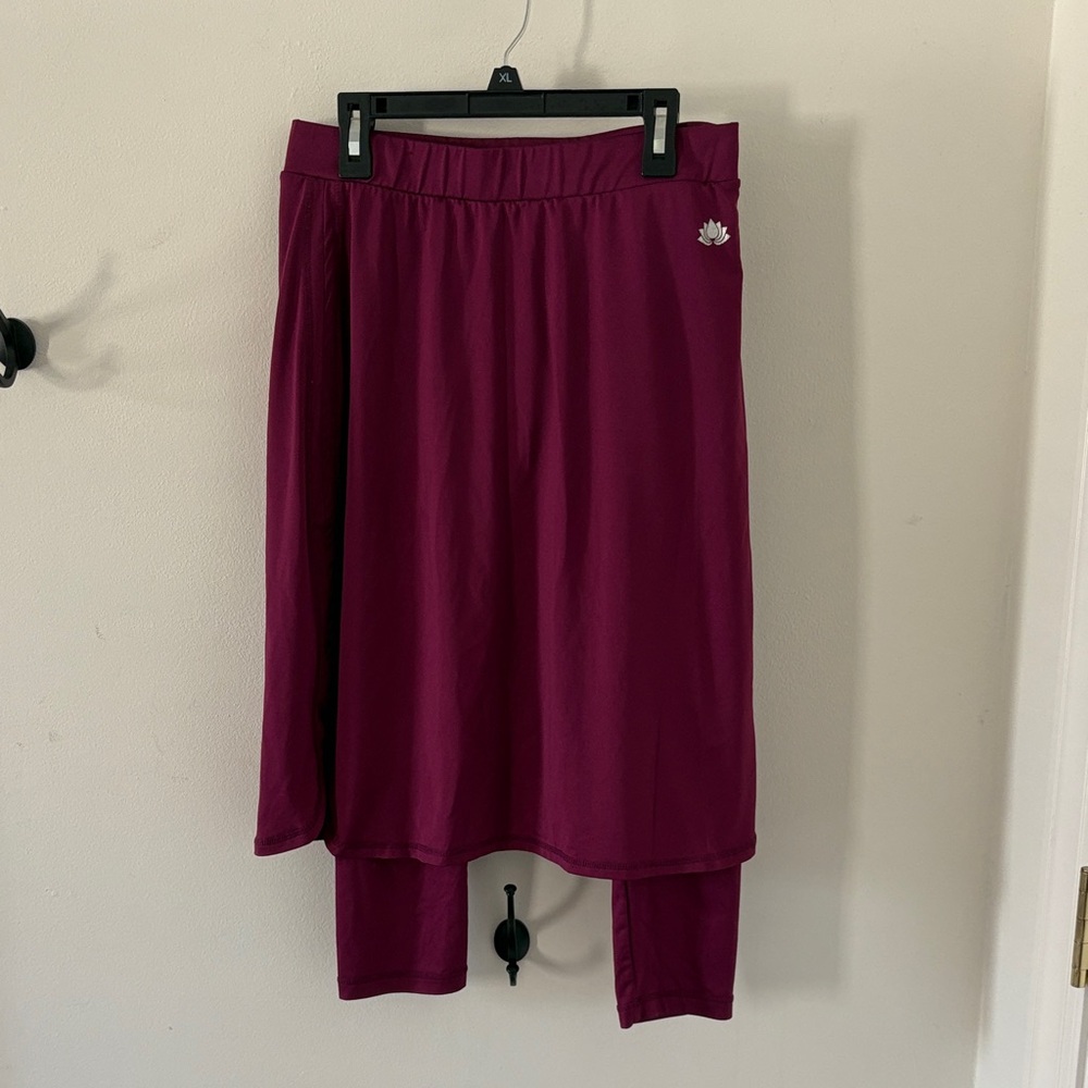 Pink “Snoga” athletic skirt, size XS.